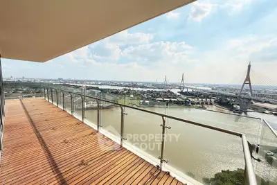 Stunning balcony with panoramic river and city views, perfect for relaxation and entertainment.