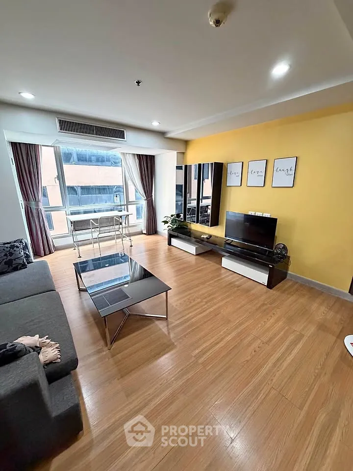 Spacious modern living room with wooden flooring and stylish decor