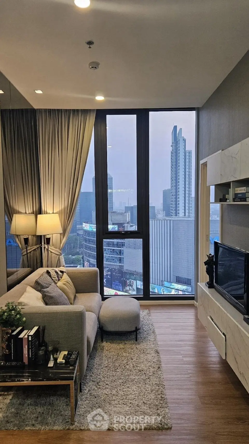 Modern living room with city view and stylish decor
