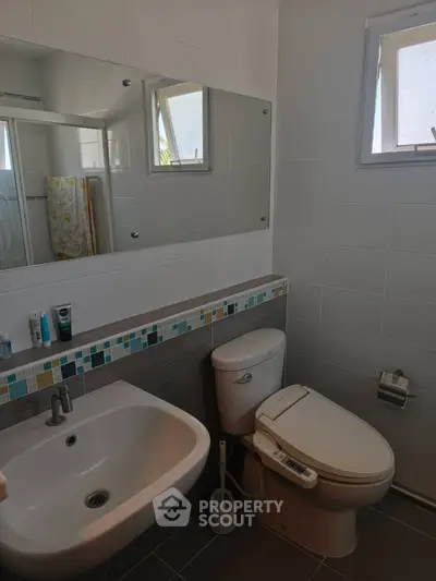 Modern bathroom with sleek fixtures and stylish tile accents