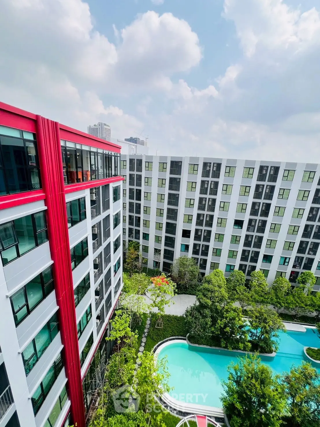 Modern architectural building with lush garden and pool view