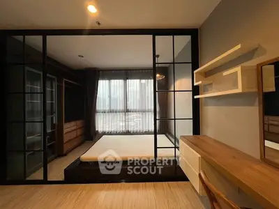 Modern bedroom with stylish glass partition and wooden furniture, perfect for a cozy and elegant living space.