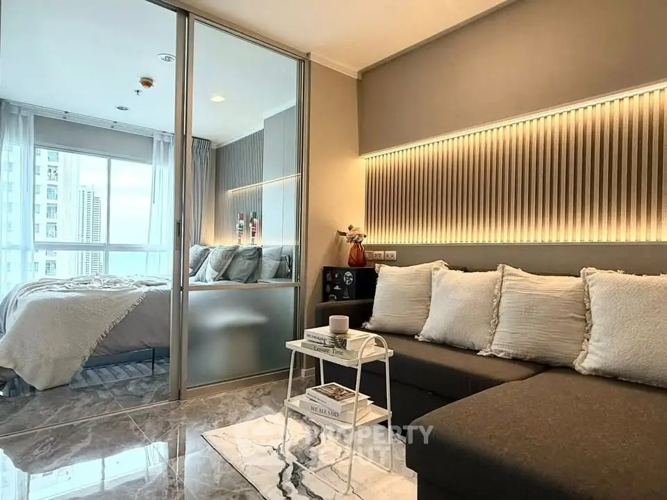 Modern living room with cozy bedroom view in luxury apartment