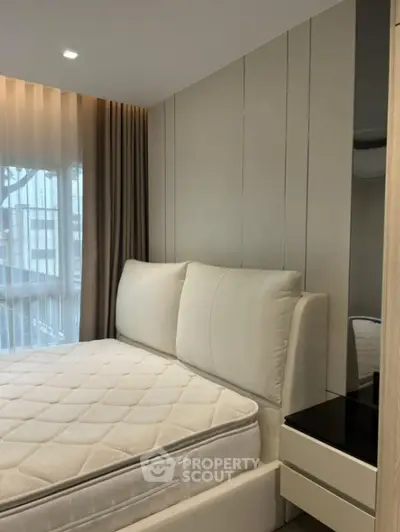 Modern bedroom with plush bed and elegant decor in a stylish apartment