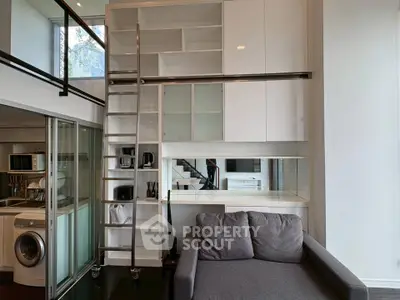 Modern loft apartment with sleek storage and cozy living area