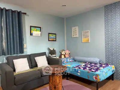 Cozy living room with sofa and playful decor, perfect for family relaxation.