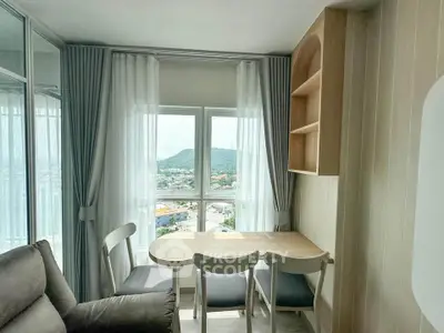 Cozy dining nook with scenic window view in modern apartment