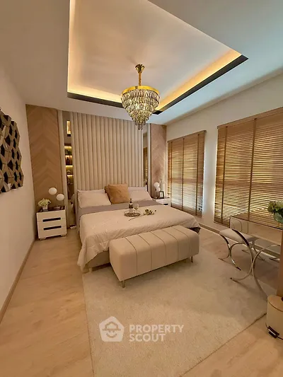 Luxurious bedroom with elegant chandelier and modern decor