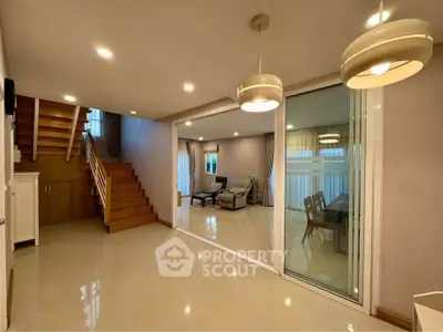 Spacious modern living room with elegant lighting and open layout