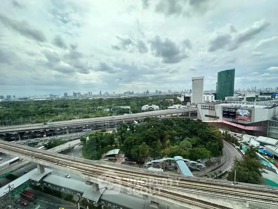 Stunning cityscape view with lush greenery and modern architecture, ideal for urban living enthusiasts.