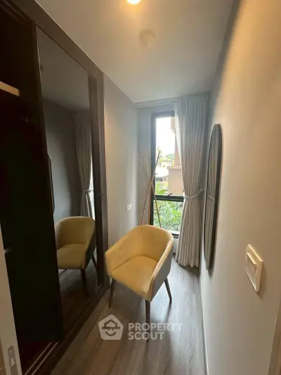 Cozy study nook with chair and window view in modern apartment