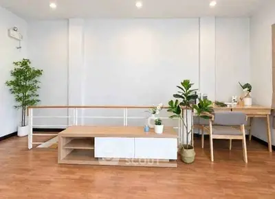 Modern living room with wooden flooring and stylish furniture