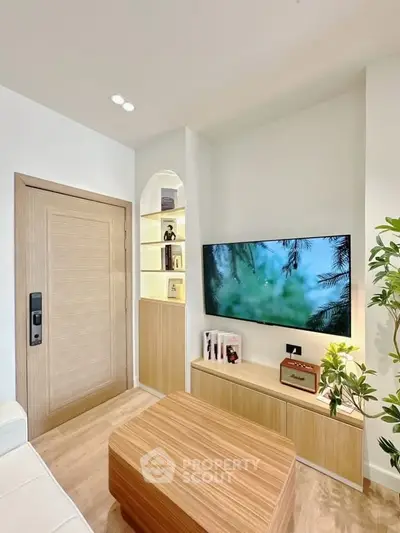 Modern living room with sleek TV setup and stylish wooden accents