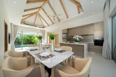Luxurious open-plan kitchen and dining area with modern design and garden view.