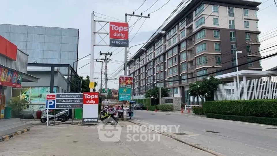 Modern urban street view with residential building and retail stores