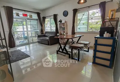 Spacious living room with modern furniture and large windows for natural light.