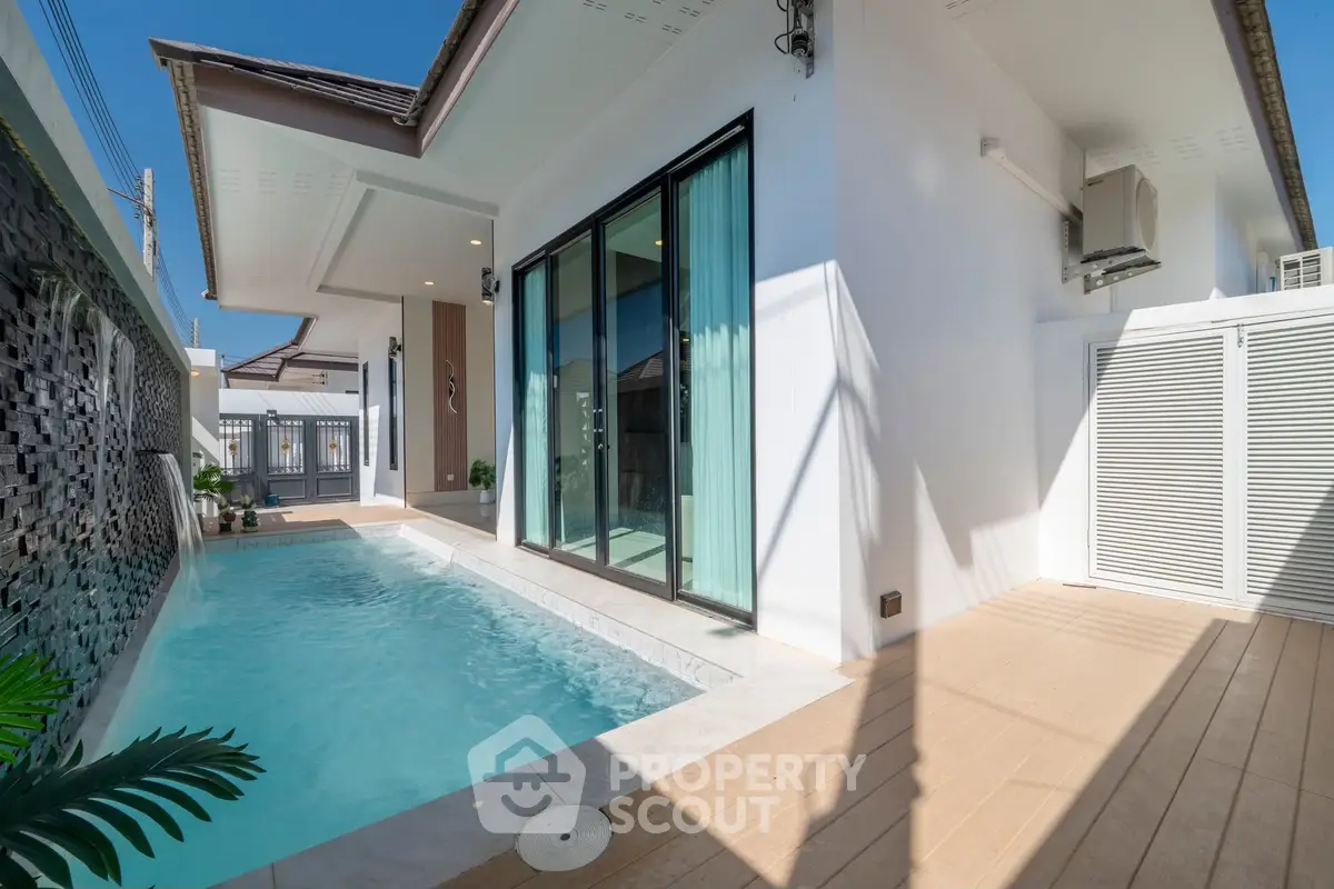 Modern villa with private pool and spacious patio in sunny setting