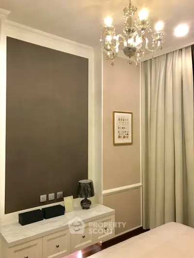 Elegant bedroom with chandelier and stylish decor