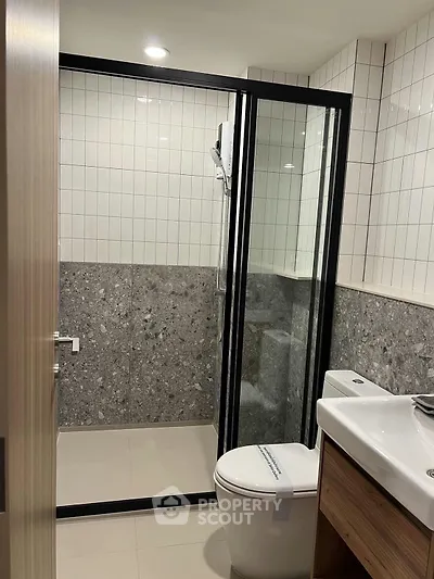 Modern bathroom with sleek glass shower and contemporary design