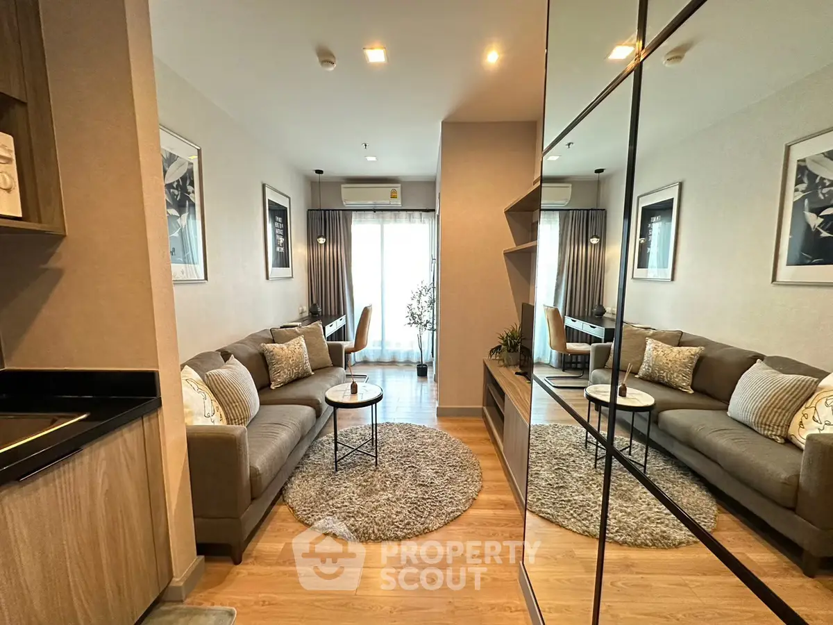 Modern living room with stylish decor and cozy seating area in a contemporary apartment.