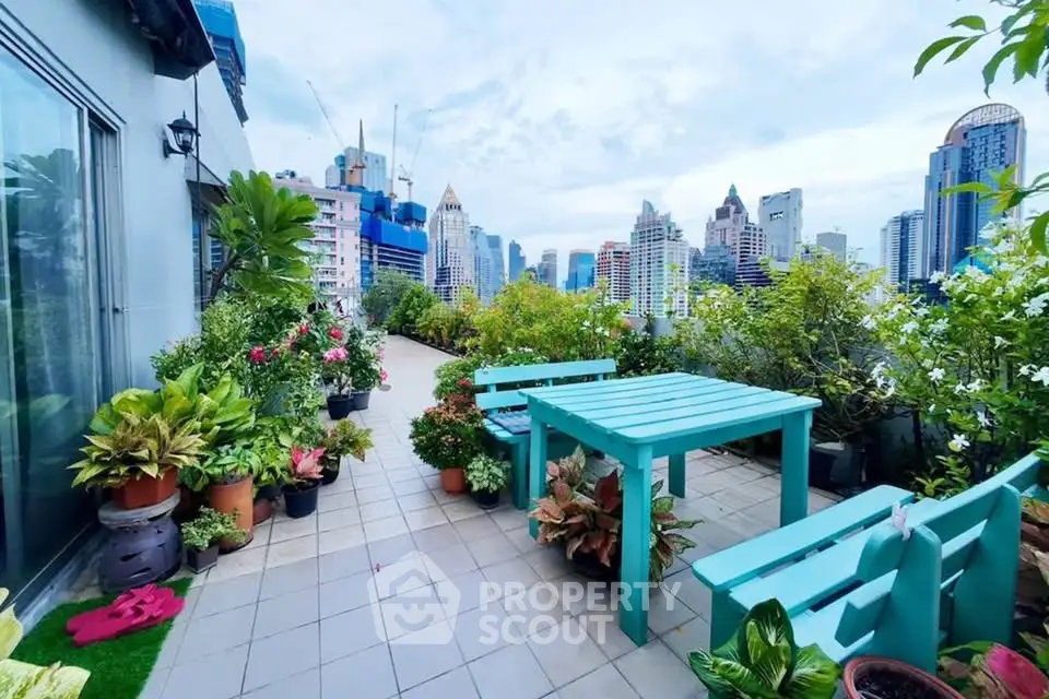 Stunning rooftop terrace with vibrant city views and lush greenery, perfect for relaxation and entertainment.