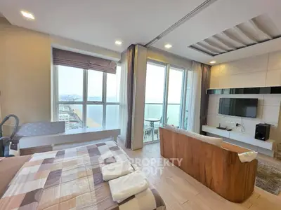 Stunning beachfront apartment with panoramic ocean views and modern living room design.