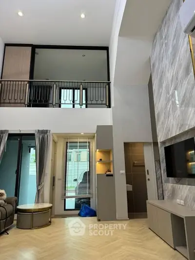 Modern living room with high ceiling and stylish decor