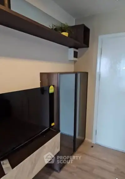 Modern living room with sleek TV stand and stylish shelving