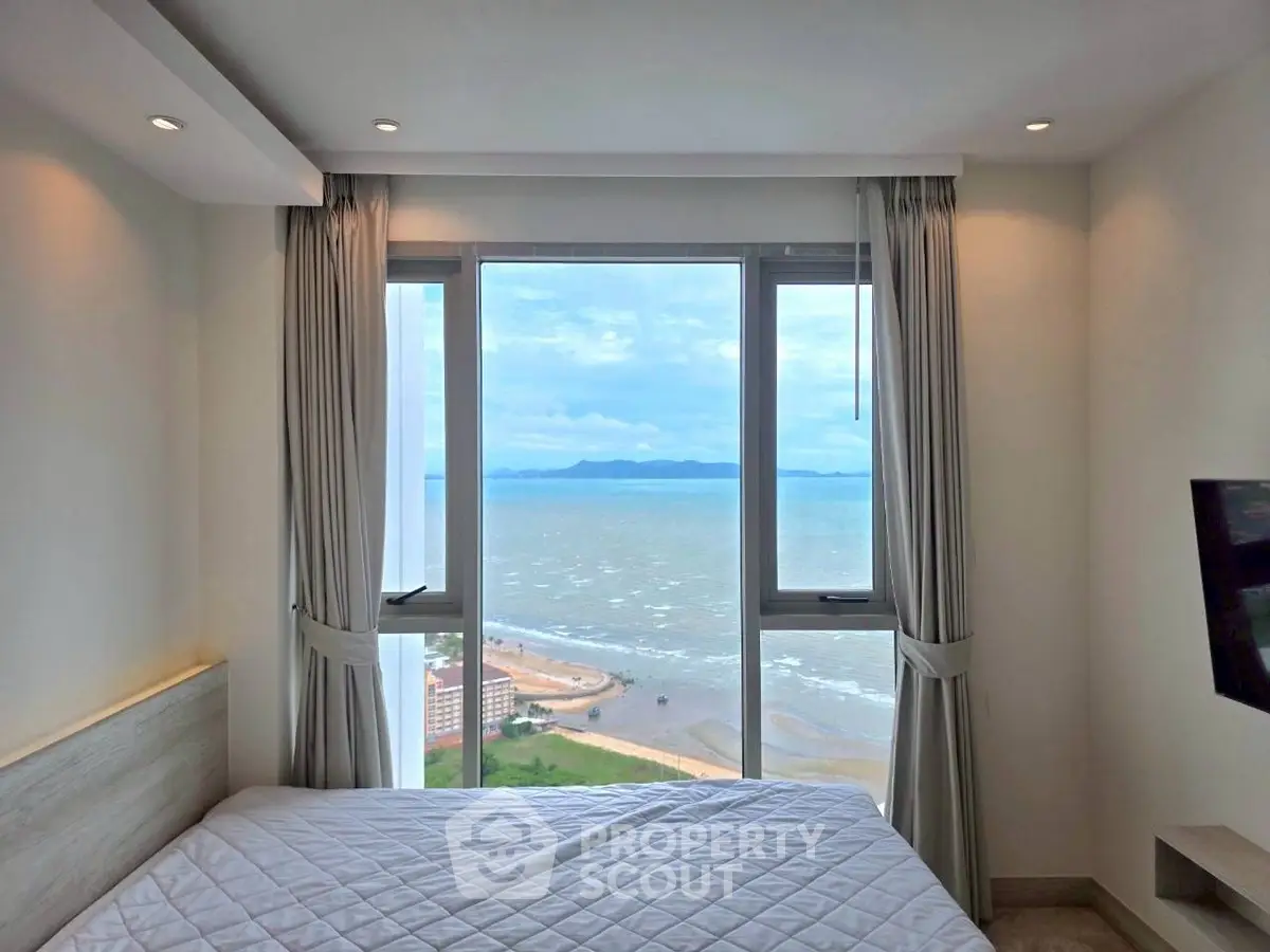 Luxurious bedroom with stunning ocean view and modern decor