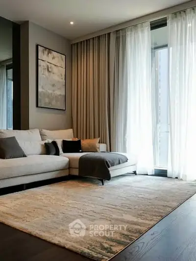 Modern living room with elegant decor and large windows