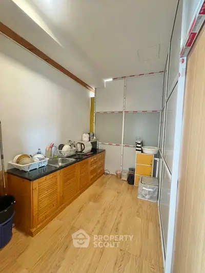 Spacious kitchen with wooden cabinets and modern appliances