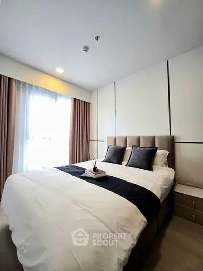 Modern bedroom with elegant decor and natural light
