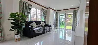 Spacious living room with garden view and elegant decor