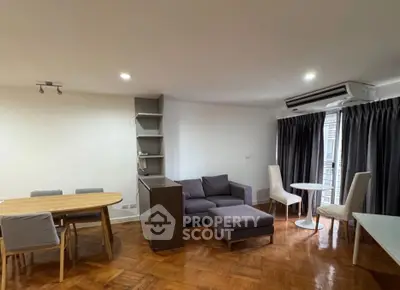 Spacious living room with modern furniture and wooden flooring