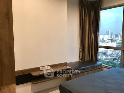 Modern bedroom with city view and elegant wooden furnishings