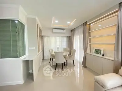 Elegant living room with modern dining area and stylish decor