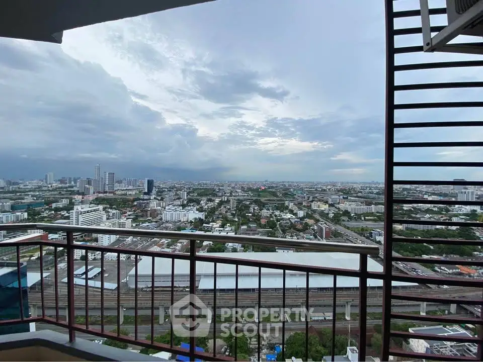 Stunning cityscape view from a high-rise balcony with expansive skyline.