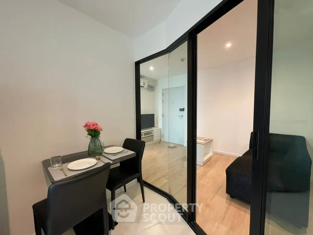 Modern apartment interior with dining area and cozy living room