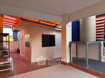 Spacious outdoor area with modern design and vibrant awnings
