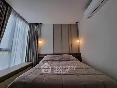 Cozy modern bedroom with stylish lighting and air conditioning