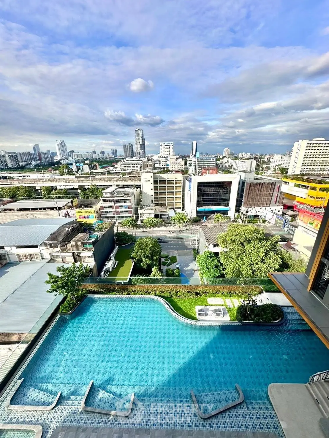 Stunning rooftop pool with panoramic city view, perfect for urban living.