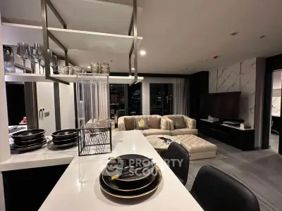 Luxurious modern living room with open kitchen and elegant decor, perfect for urban living.