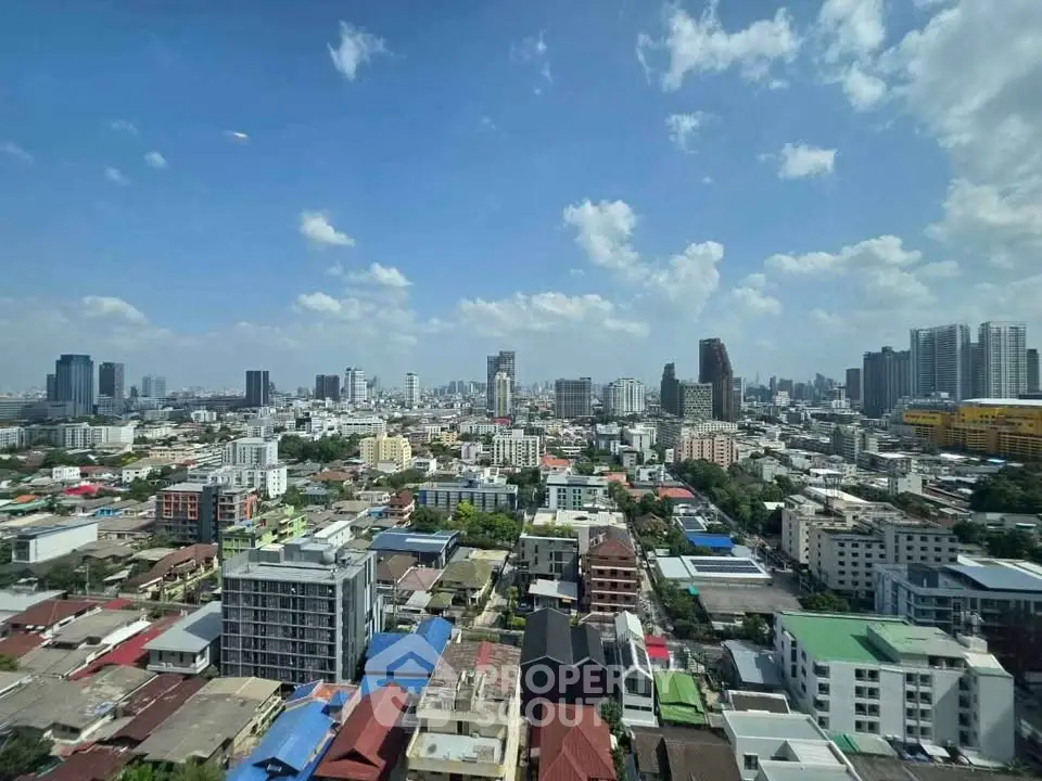 Stunning cityscape view showcasing a vibrant urban skyline under a clear blue sky.