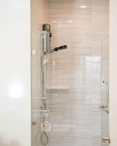 Modern bathroom shower with sleek glass enclosure and stylish fixtures