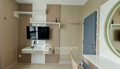 Modern living room with wall-mounted TV and stylish decor