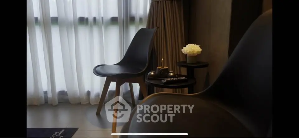 Modern interior with stylish chairs and elegant decor near a window.