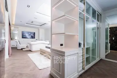 Luxurious modern living room with elegant white furniture and stylish shelving