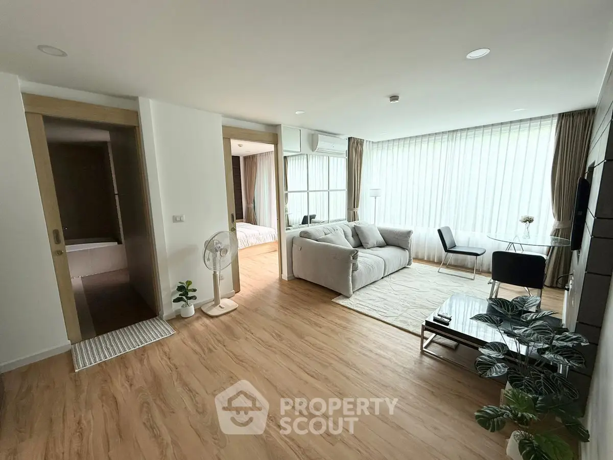 Spacious modern living room with natural light and stylish decor