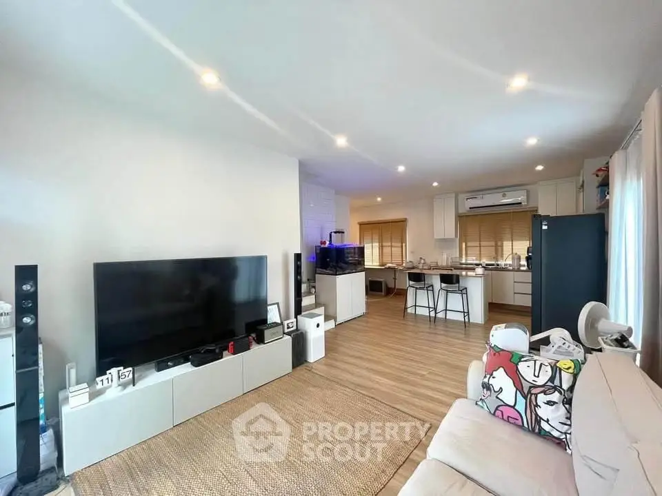Spacious modern living room with open kitchen and stylish decor