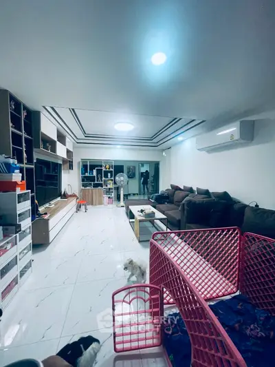 Spacious living room with modern decor and ample storage solutions